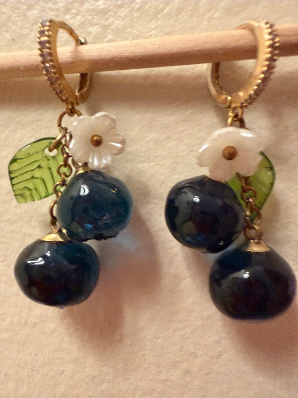 Sweet Glass Blueberry Earrings with small white flowers and green leaves
